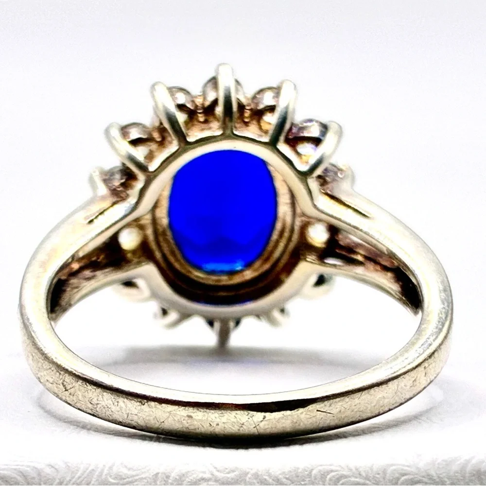VTG Signed JC Oval Cut Cubic Zirconia Sapphire with Halo of CZ’s In Silver Tone